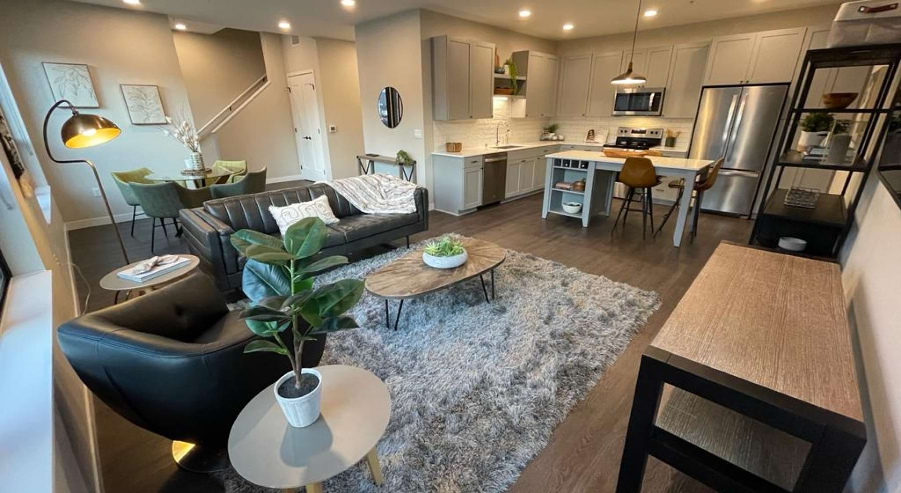 living room with a couch and area rug