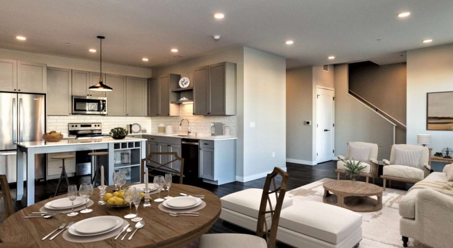 living room open to kitchen with white cabinets